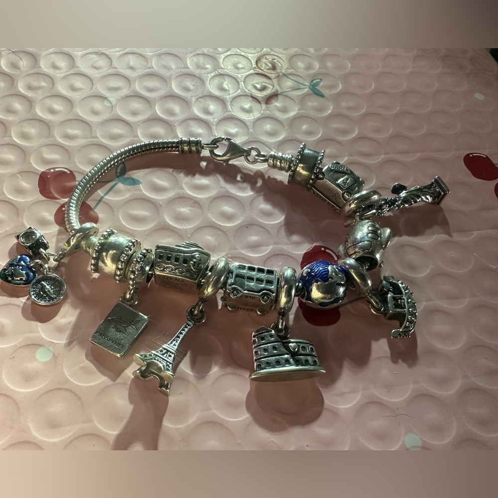 authentic Pandora Travelers charm bracelet. It’s a must have if u travel a-lot. - Picture 2 of 9